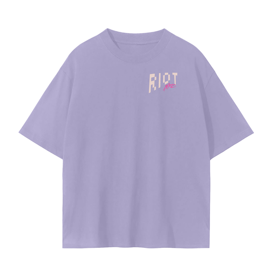 Lavender tee front with small RIOT + neon NYC chest logo.