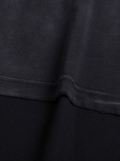 Bleed Electric Let The Invasion Begin black cotton t-shirt fabric close up showing vintage wash texture and raw edge finish
