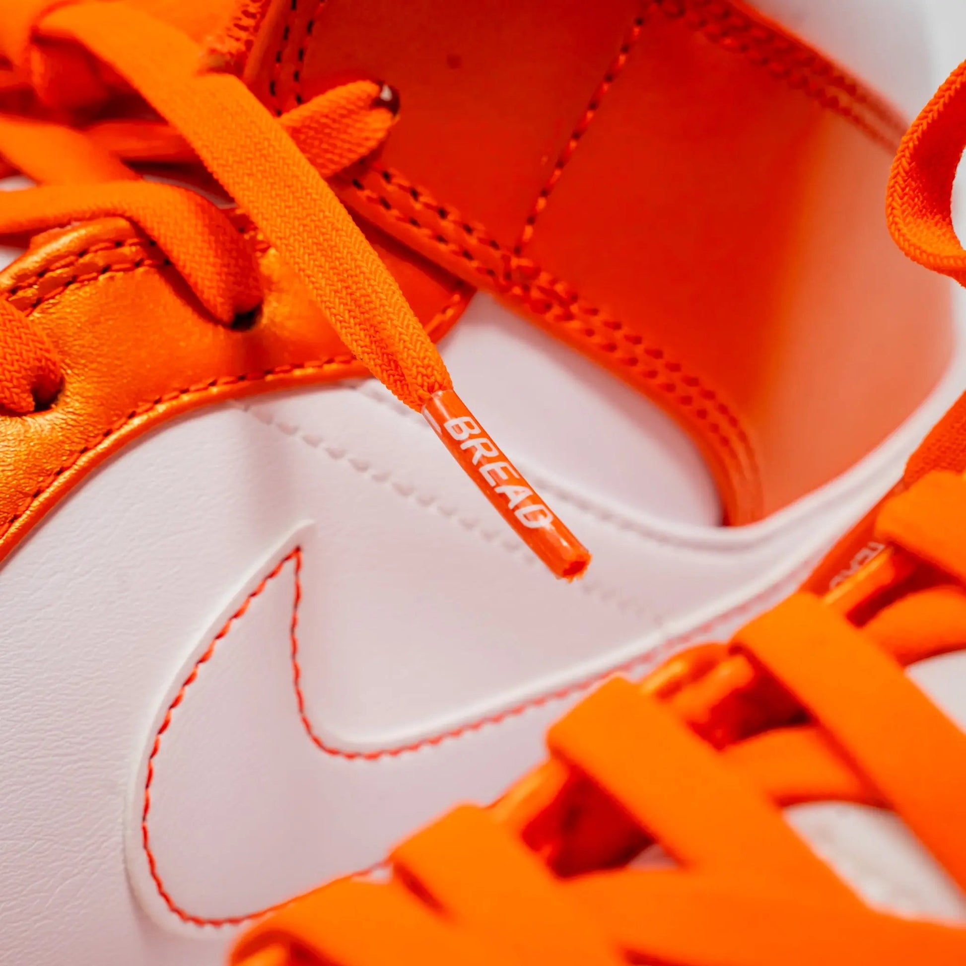Coral Orange Bread shoelace with branded aglet detail