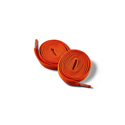 Coral Orange Bread elastic shoelaces coiled with branded aglets