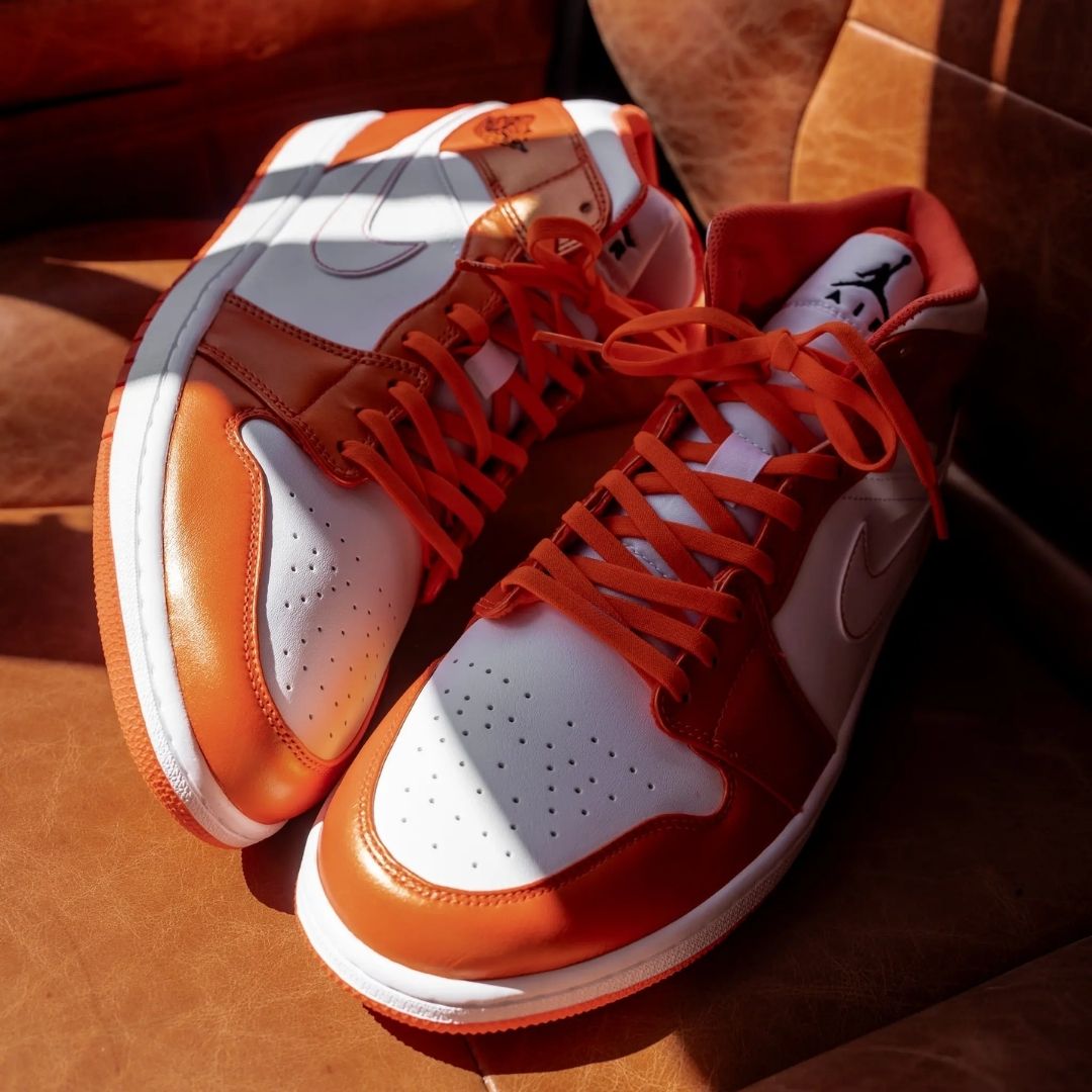 Orange and white sneakers styled with Coral Orange Bread elastic shoelaces