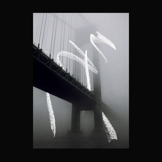 Foggy bridge photo with white chalk graffiti-style marks layered on top using texture pack