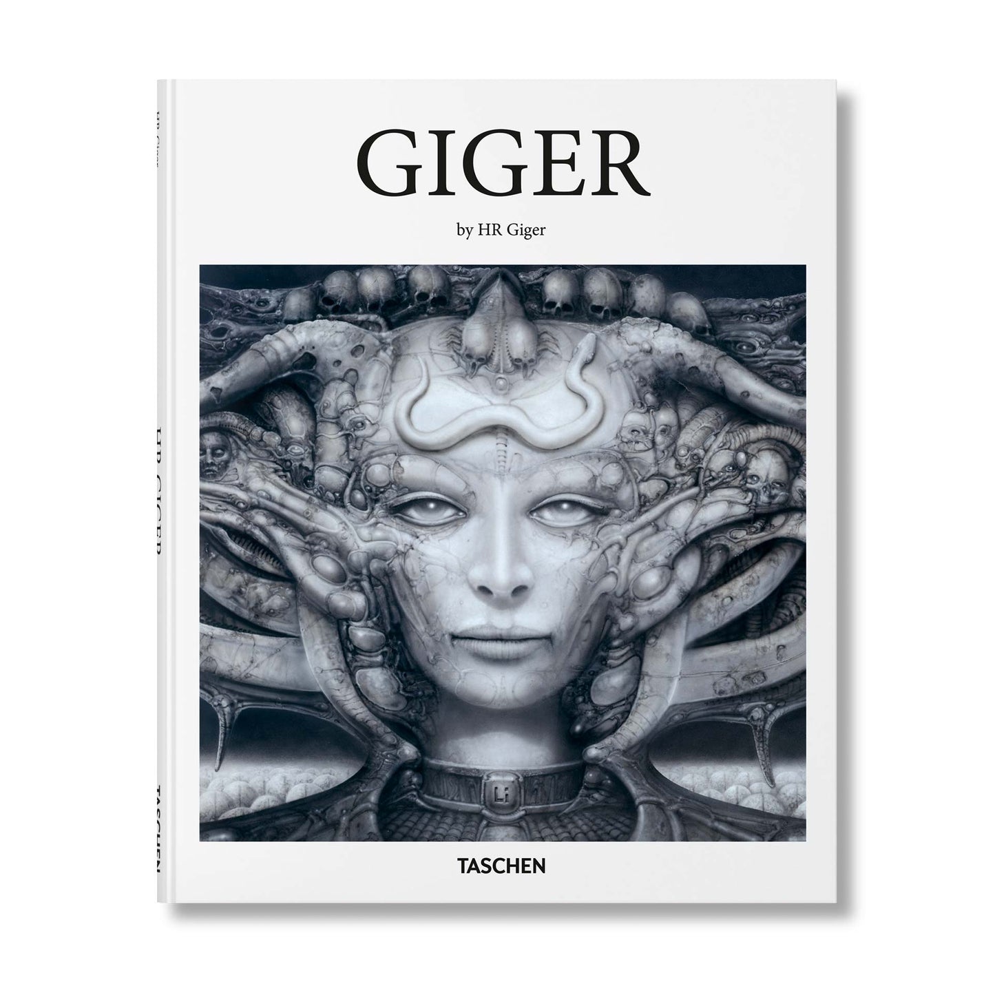 H.R. Giger book cover by TASCHEN featuring a biomechanical female face surrounded by skulls, tubes, and alien forms