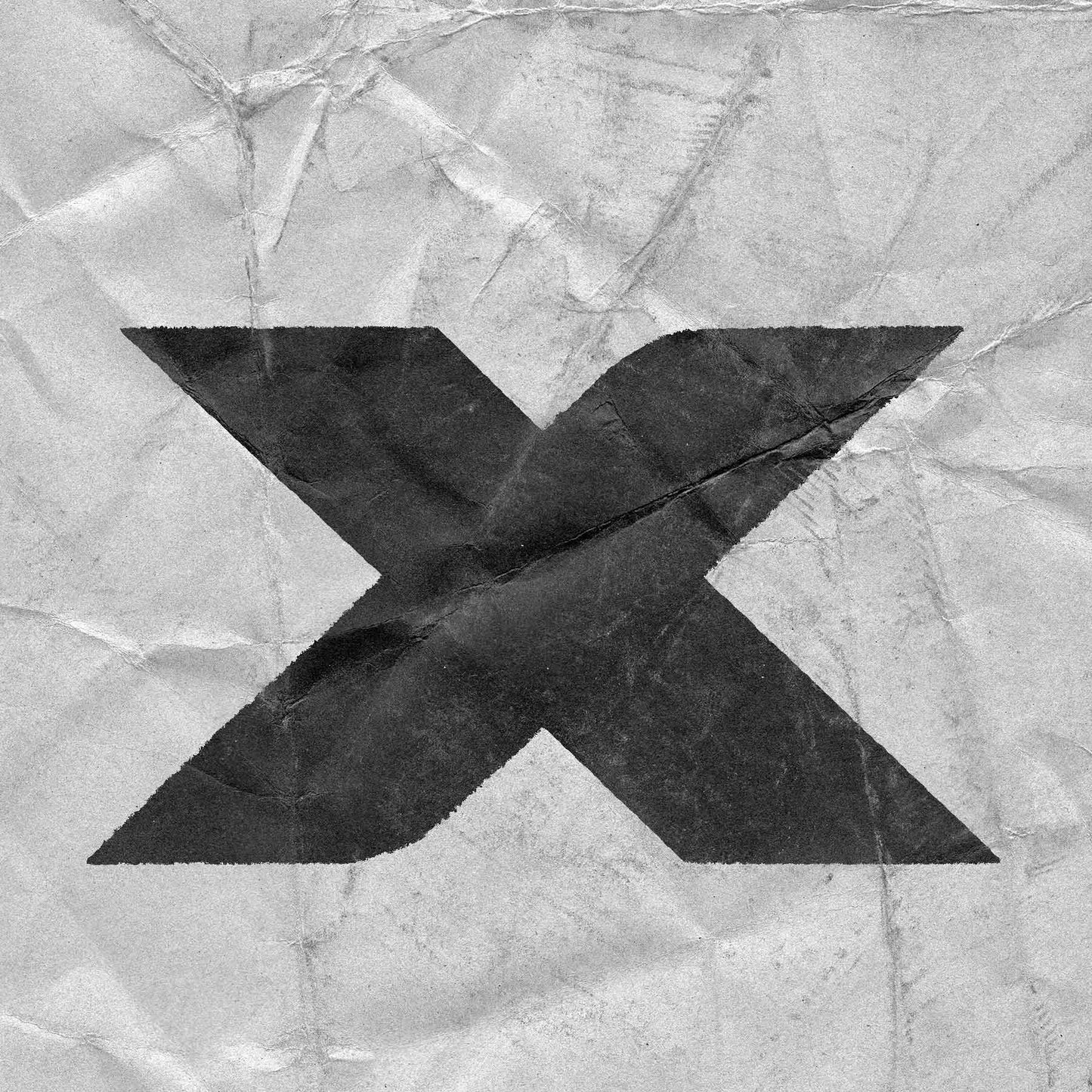 Large black X symbol with paper creases and texture