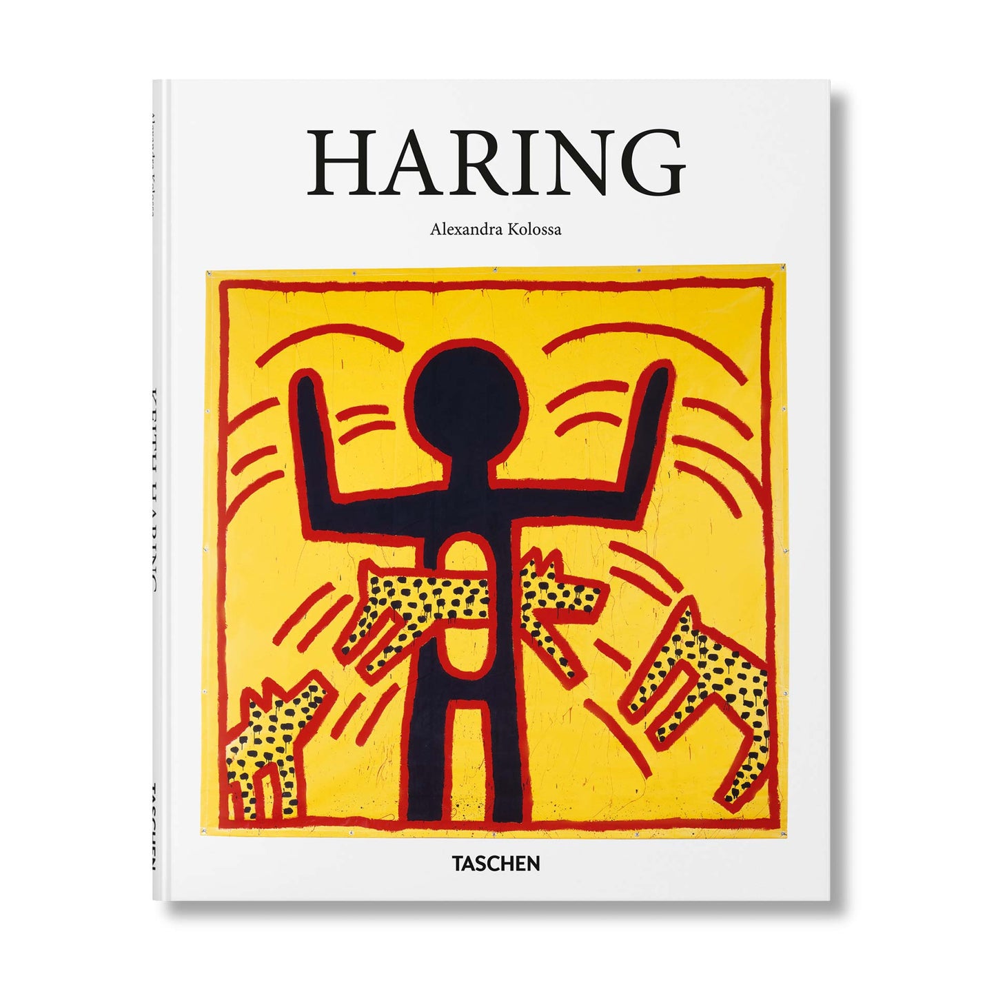 Keith Haring book cover by TASCHEN featuring a bold yellow painting with a black radiant figure and barking dog motifs