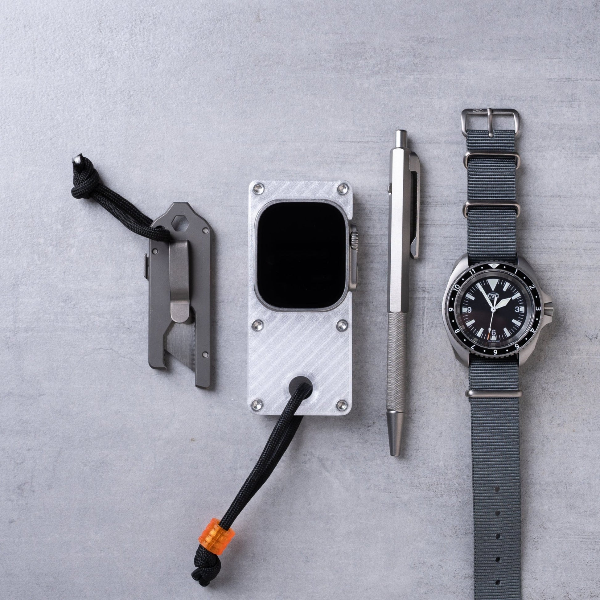 miniphone ultra ghost white Apple Watch Ultra case flat lay with everyday carry tools and watch