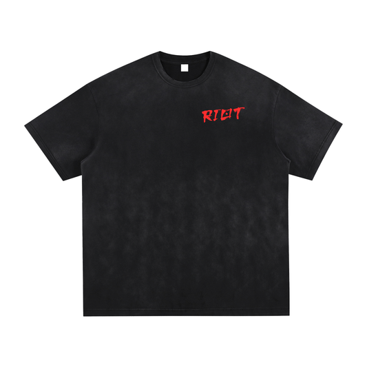 Front of black oversized t-shirt with red brushstroke RIOT logo on chest