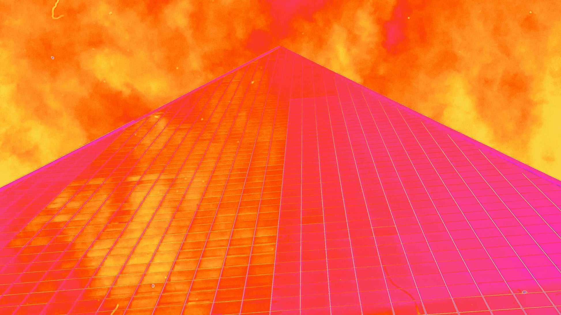 Dramatic upward view of skyscraper tinted with intense red and orange thermal gradient effects from secret-cache Photoshop pack.