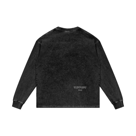 Oversized washed black long sleeve with RIOT CREATIVE AGENCY, NYC coordinates, and riot.nyc print at lower back.