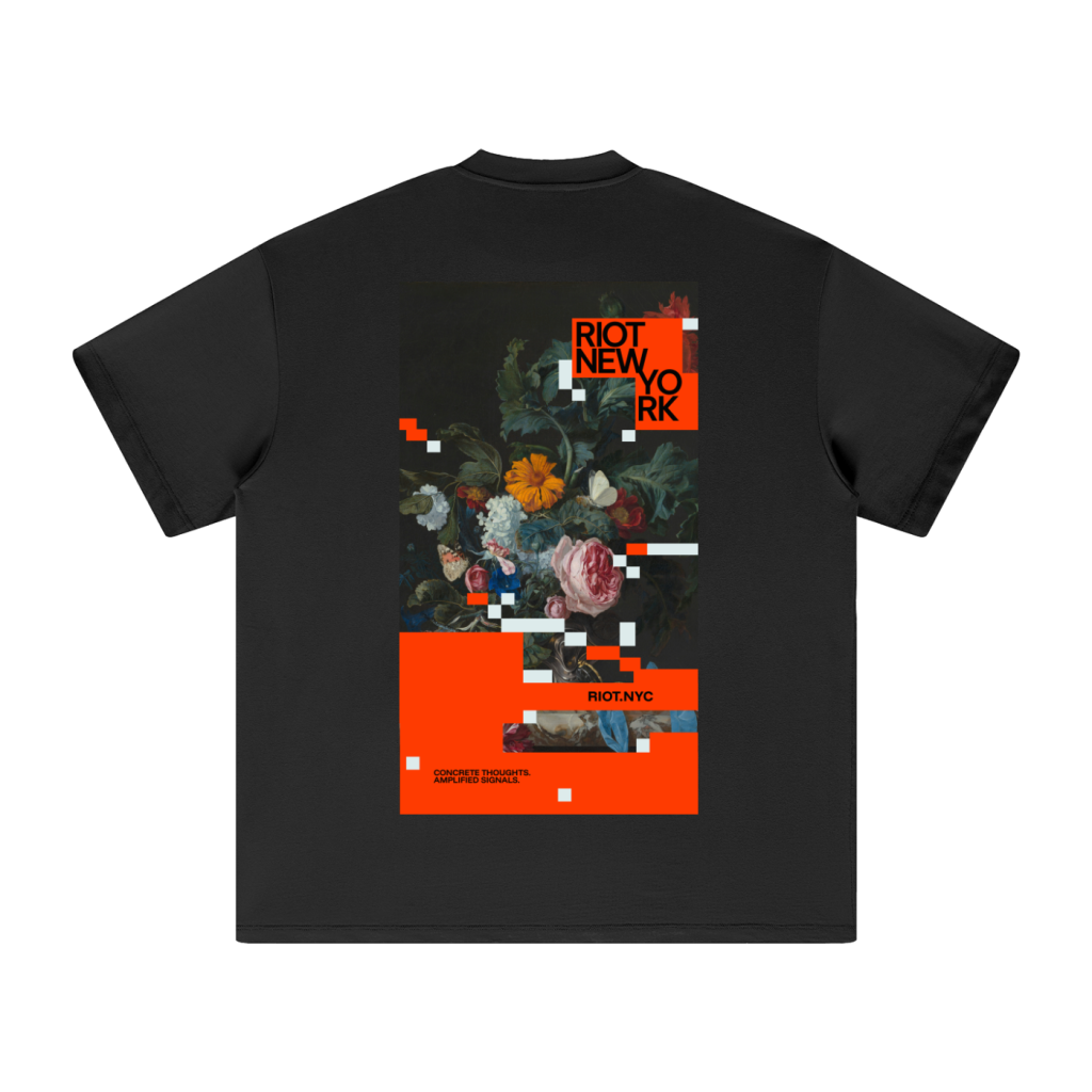 Black tee back with RIOT NEW YORK poster: glitched floral still life, white pixel blocks, bold orange panels, and RIOT.NYC bar.