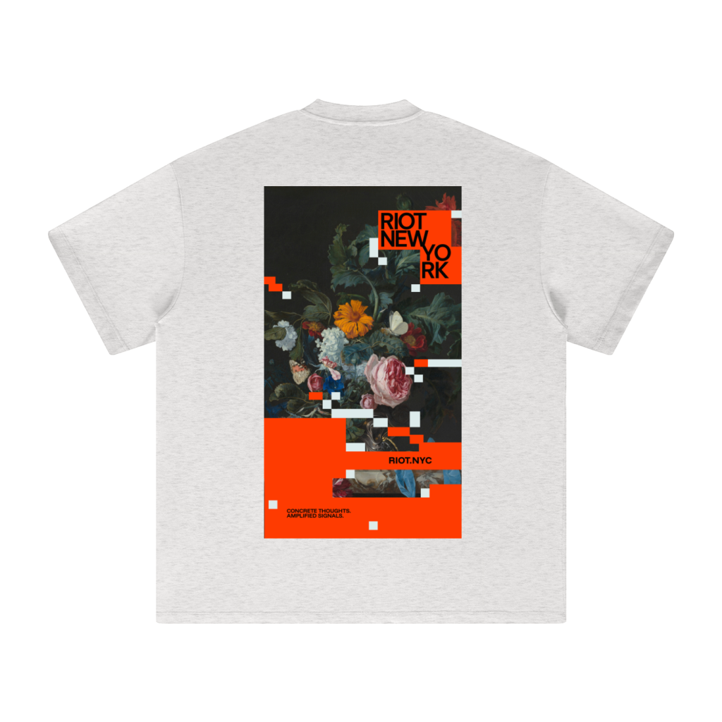 Light gray tee back showing the full glitched‑floral poster with orange slab and pixel fragments.