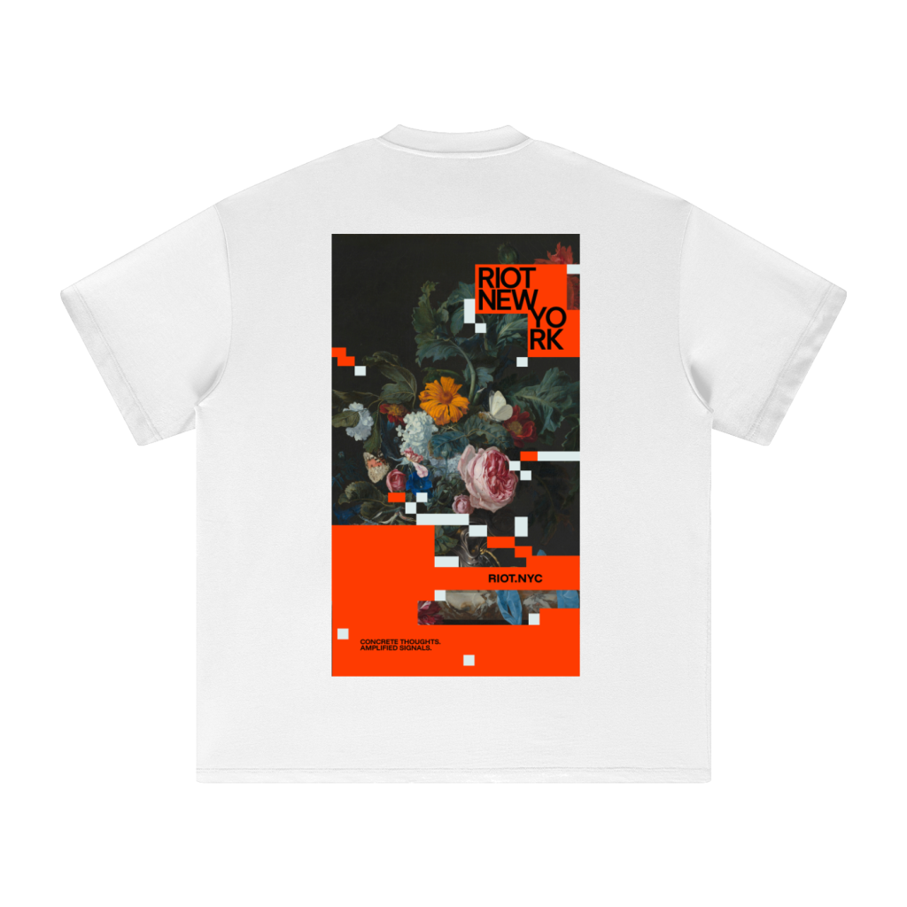 White tee back with RIOT NEW YORK glitched‑floral poster and orange lower panel.